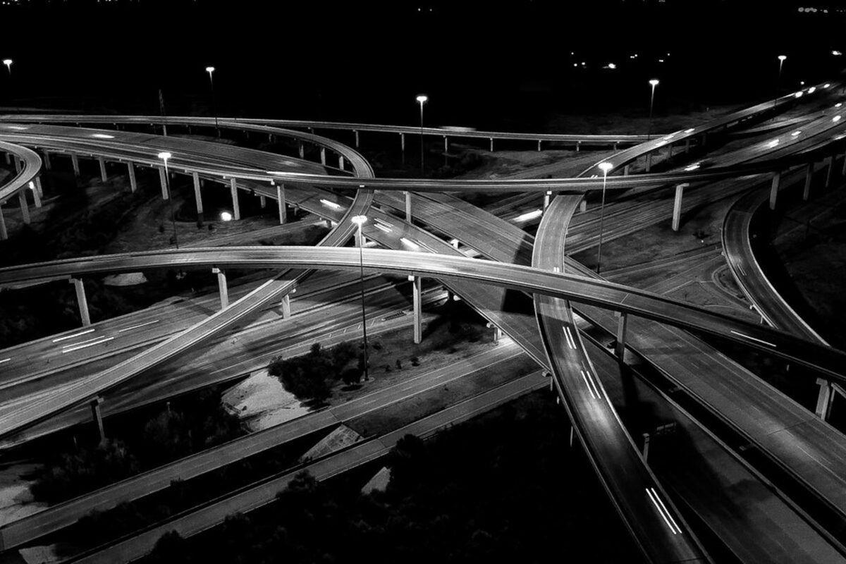 Aerial night view of an interchange, abstract workflow metaphor